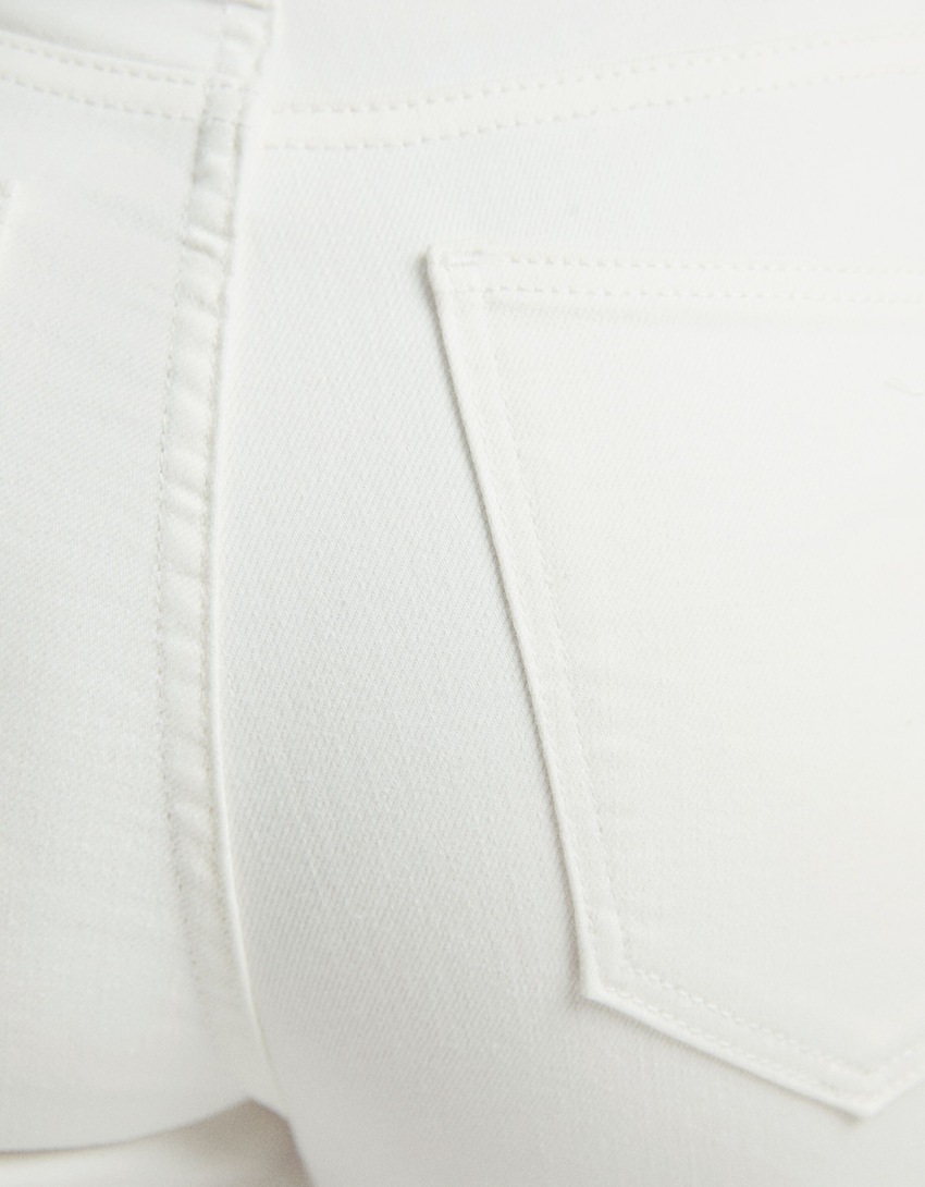 calça jeans skinny de cintura super alta