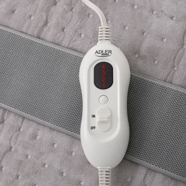 Varmebelte i ryggen med justerbar temperatur og myk fleece