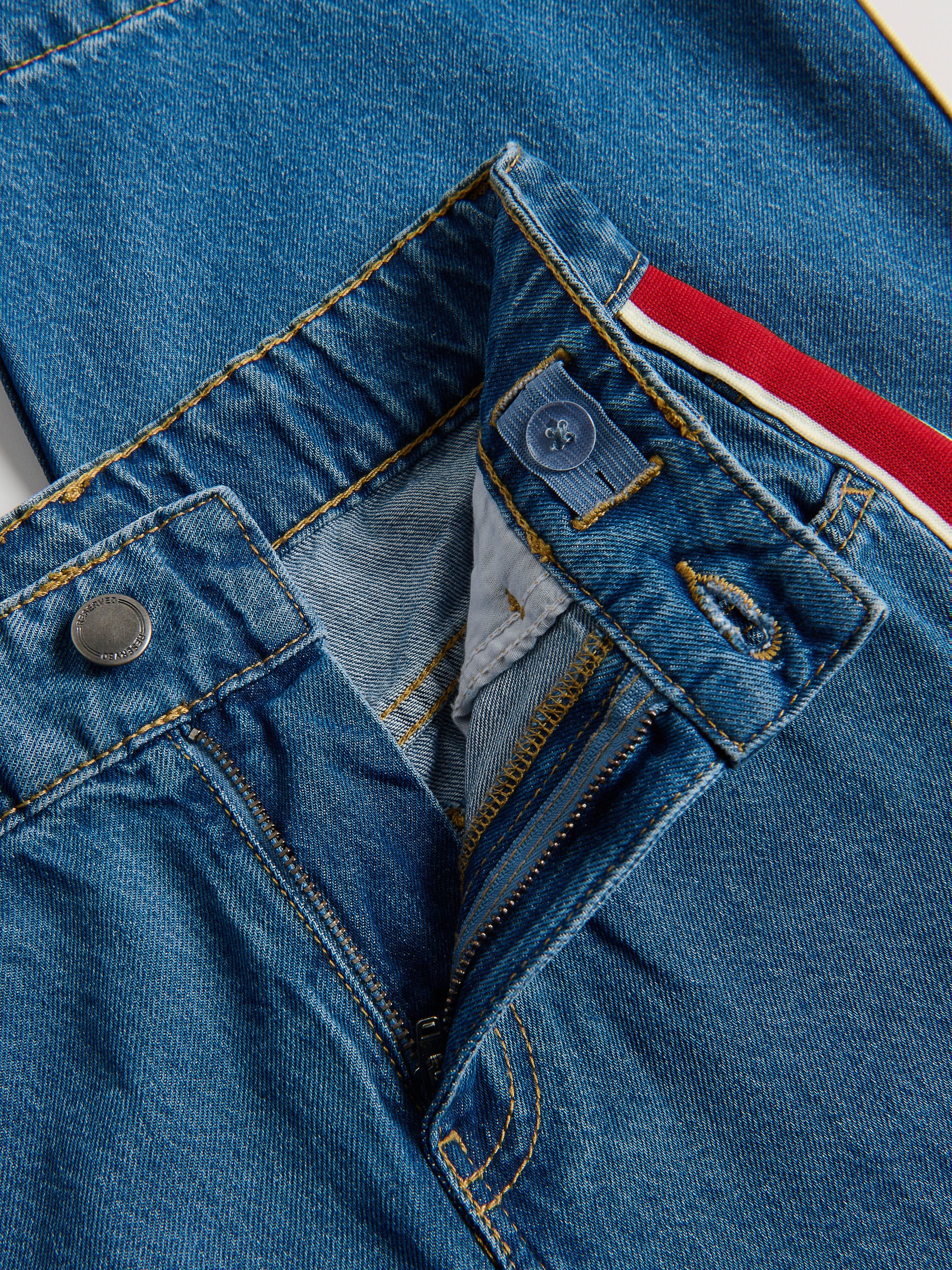 Superweite Jeans mit Seitenstreifen