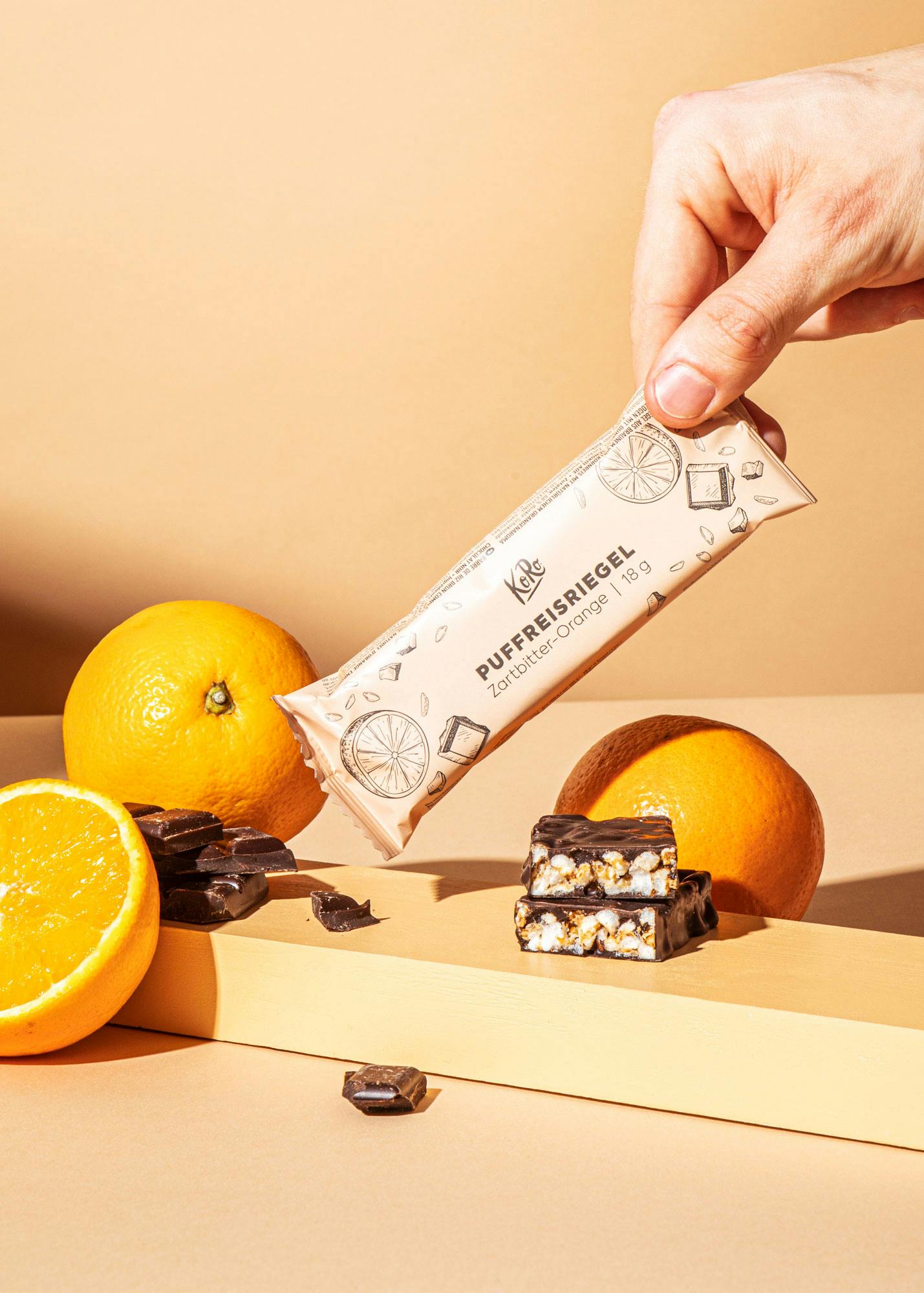 Puffreisriegel in Zartbitterschokolade mit Orange 18 g