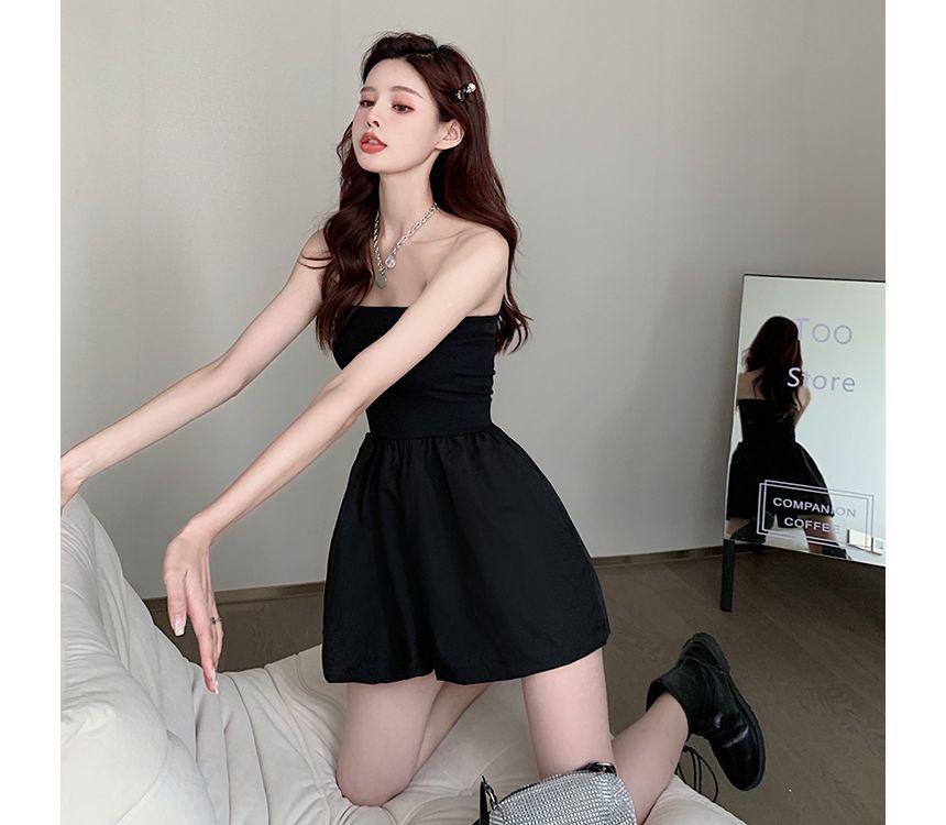 Cerauno - Strapless romper met wijde pijpen