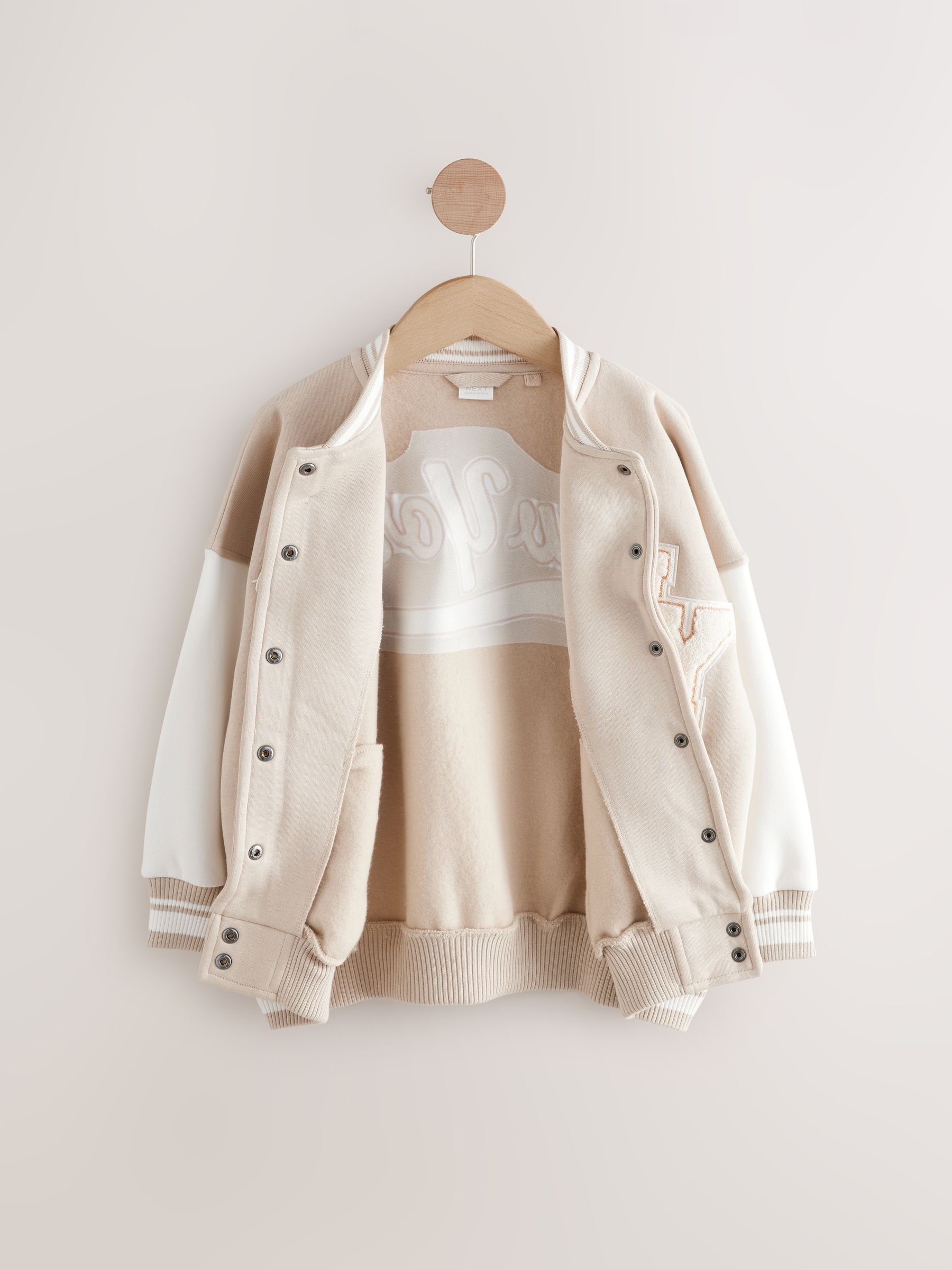 Beige boucle - Geborduurd Varsity-jasje (3 - 16 jr)
