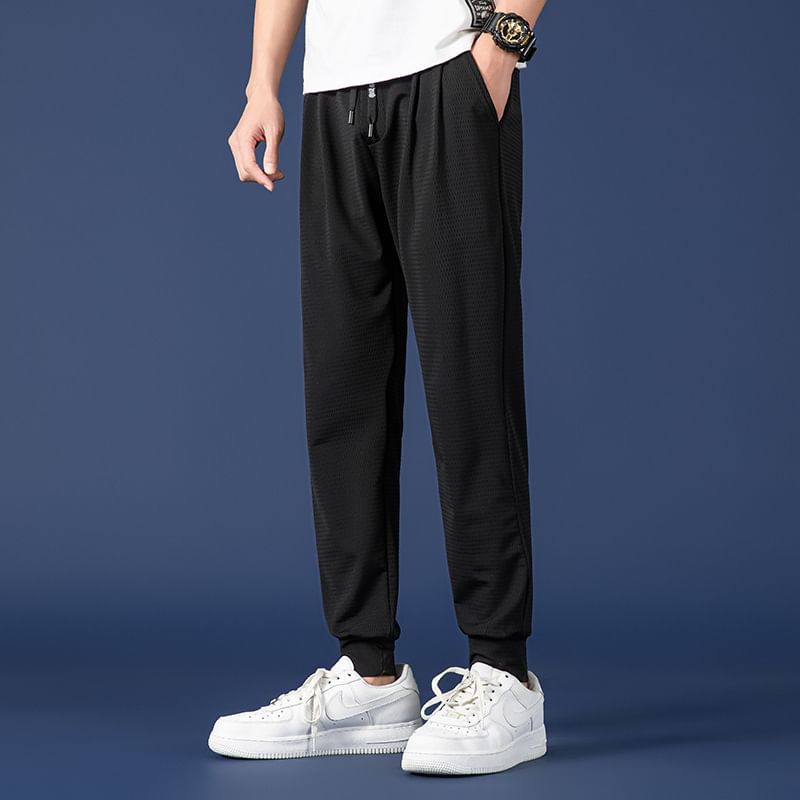 Acrius - Effen cropped harembroek met trekkoordtaille