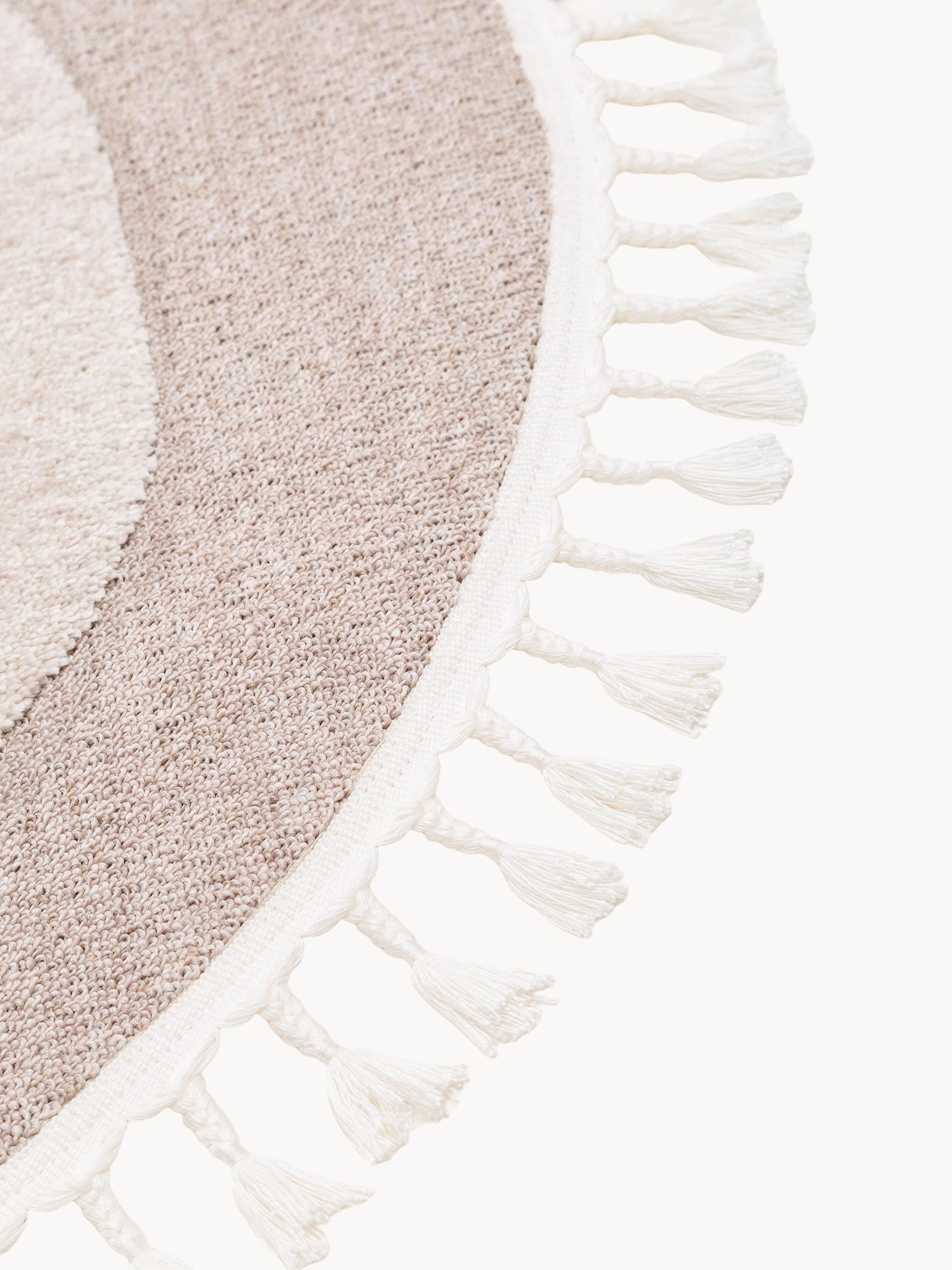 Rond kindervloerkleed Momo met kwastjes en hoog-laag effect