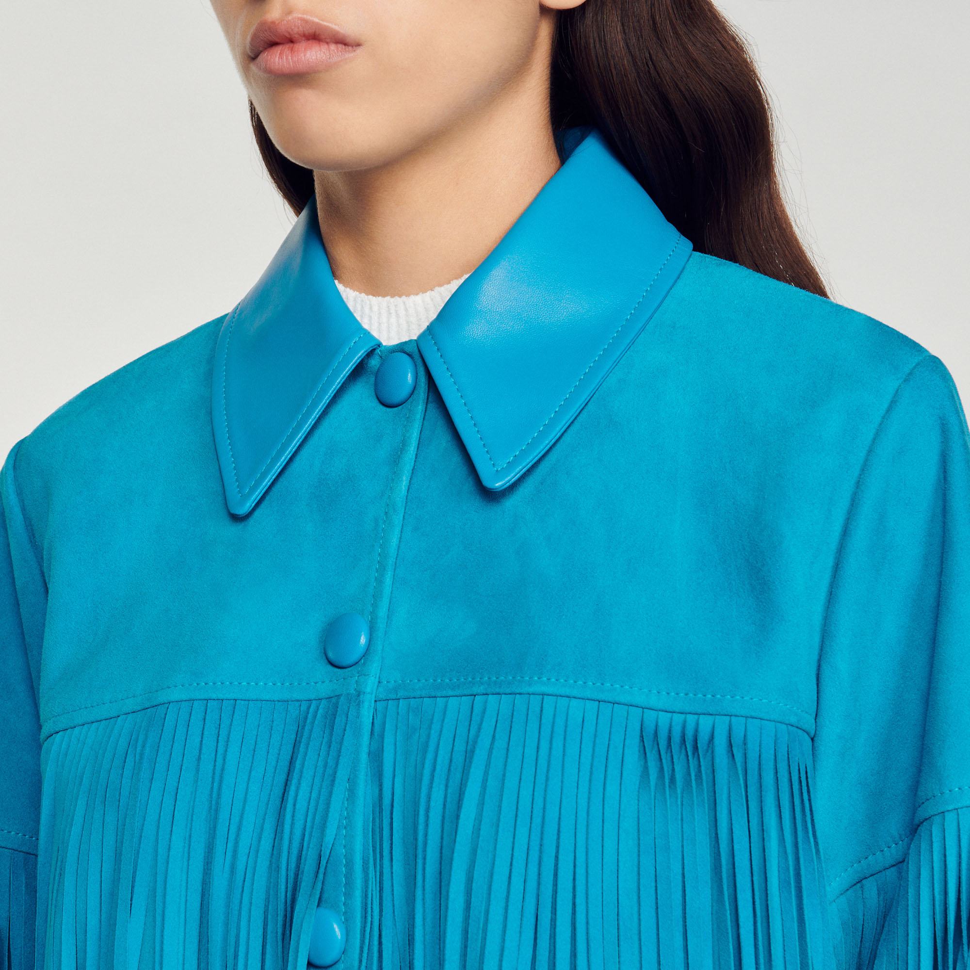 Veste longue en cuir á franges
