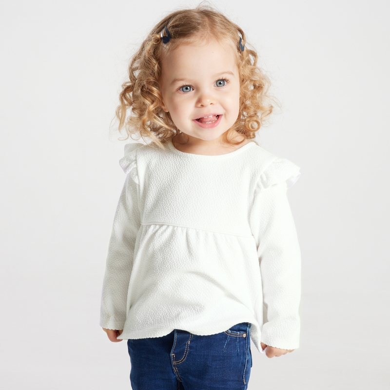 Blouse unie tissu gaufré à volants blanche bébé fille