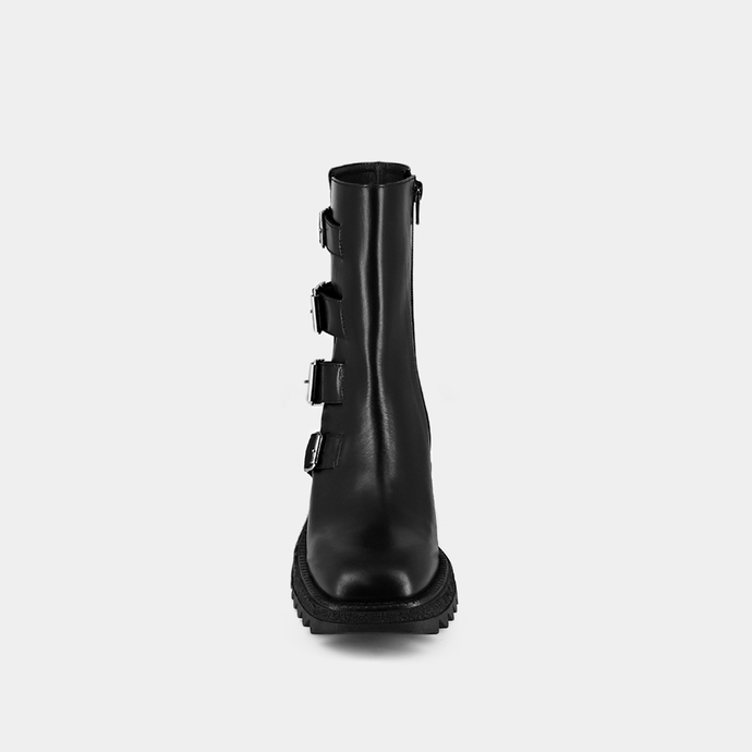 Boots à sangles et semelles crantées  en cuir glacé noir