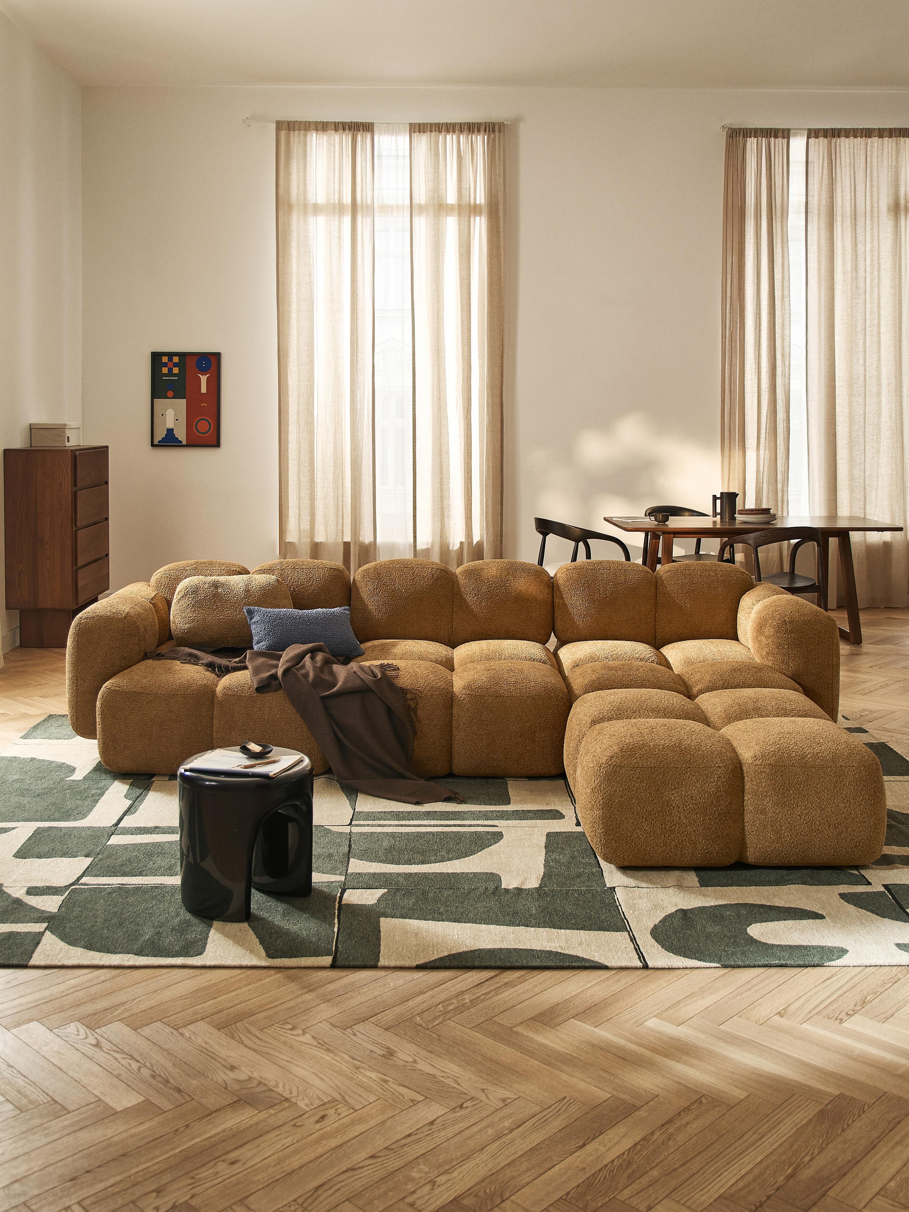 Modulaire bank Tayla (4-zits) van teddy bouclé met poef (links/rechts)
