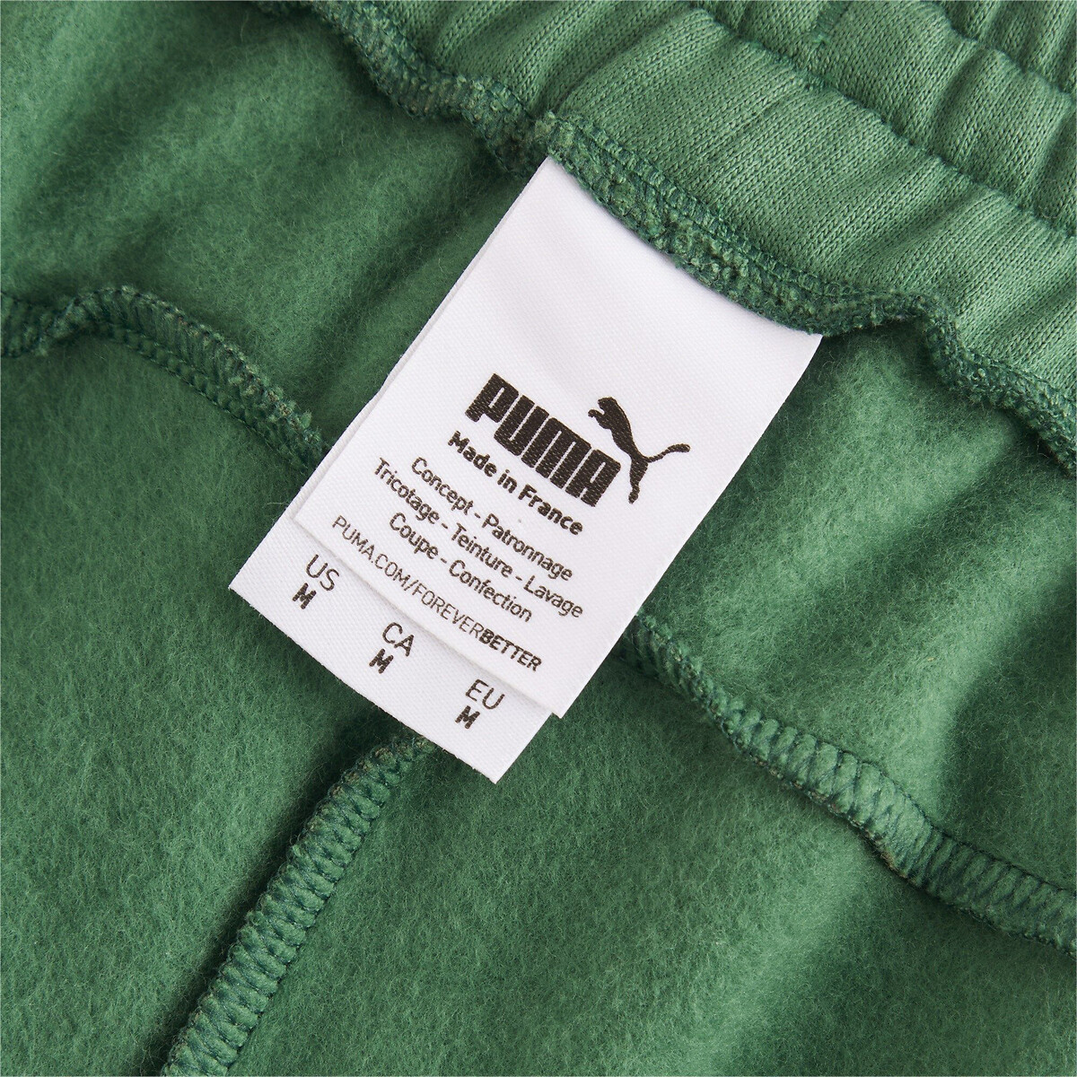 Calças unissex PUMA, fabricadas na França.