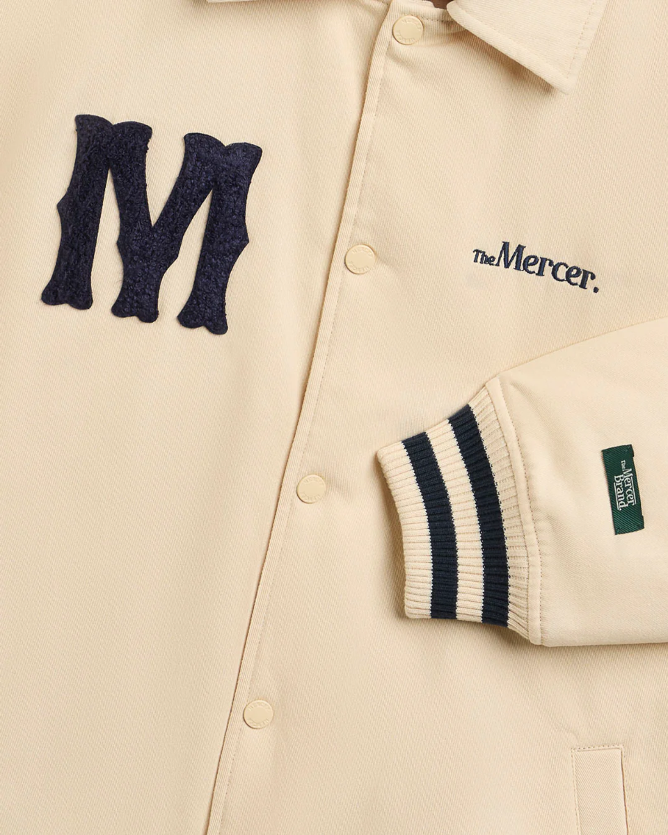 Mercer Amsterdam The Varsity Polo Roomwit Jas