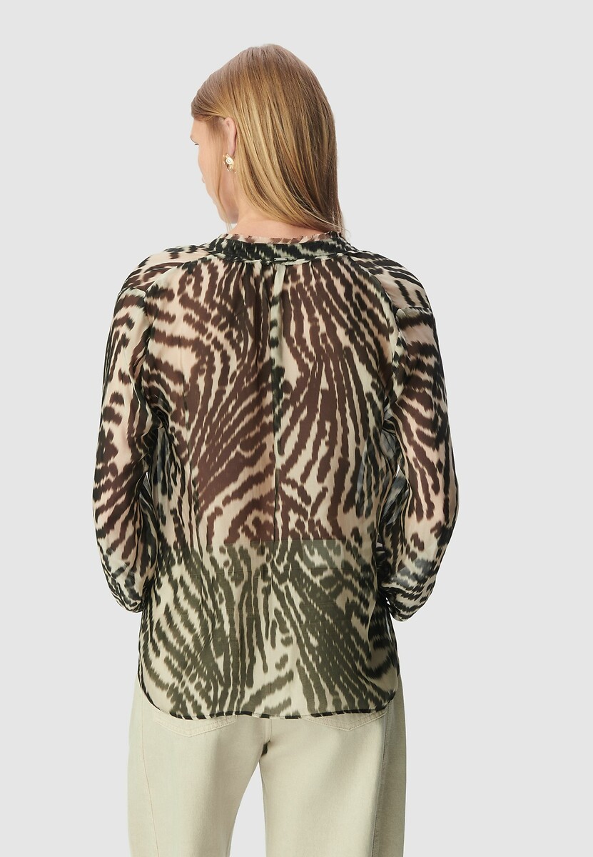 Blusa de manga comprida IKKS com estampa de zebra e laço no pescoço.
