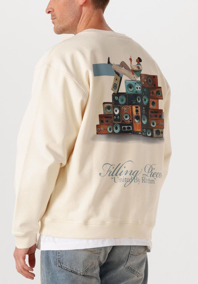 creme filling pieces sweater sweatshirt speaker wall