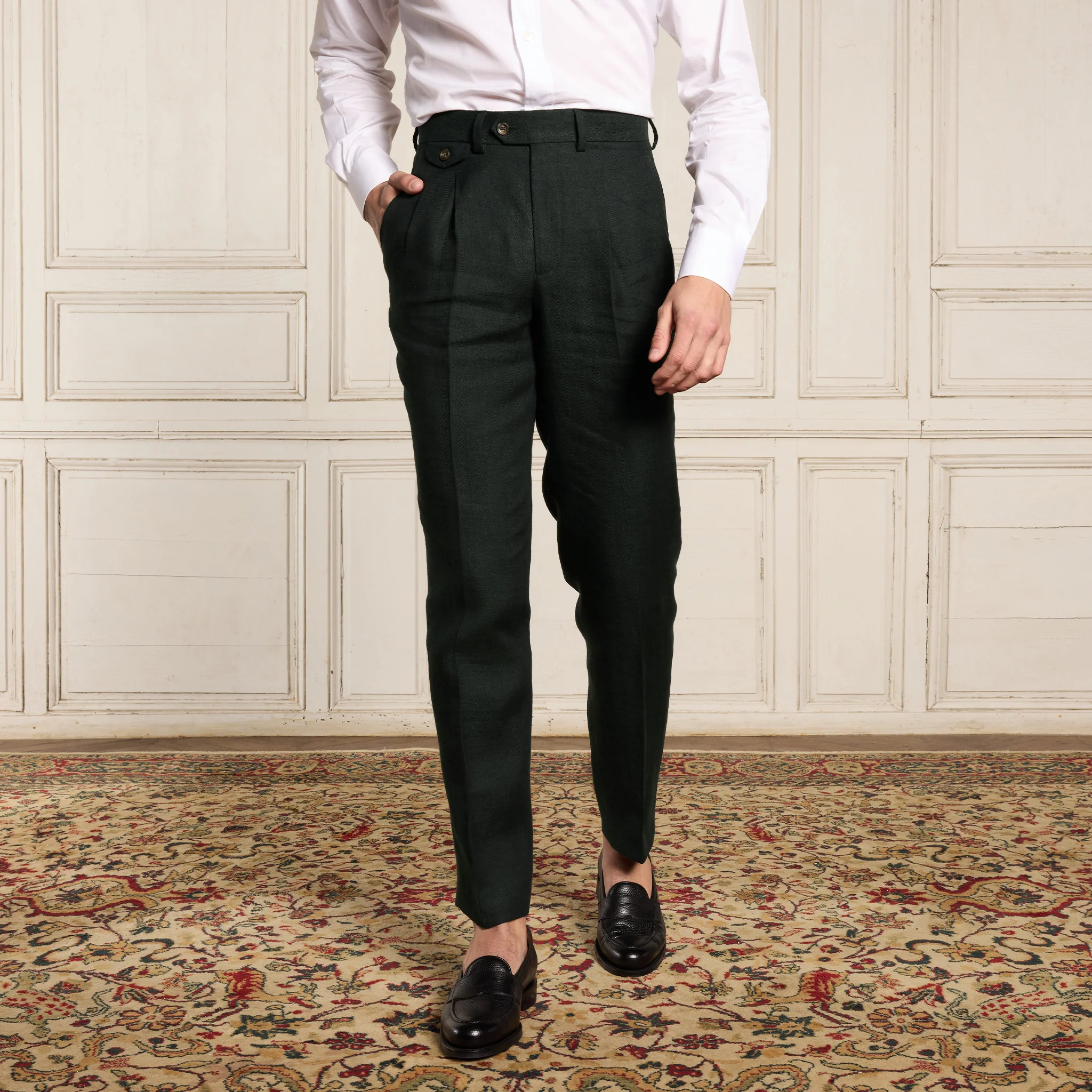 Double-pleated green linen pants