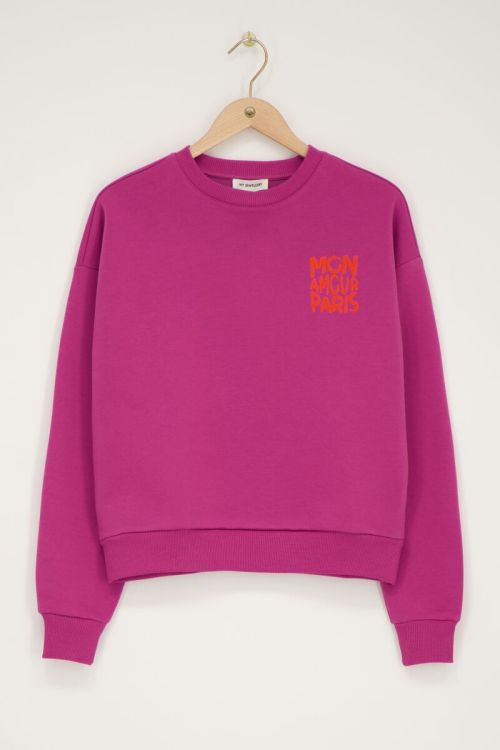 Paarse sweater met oranje 