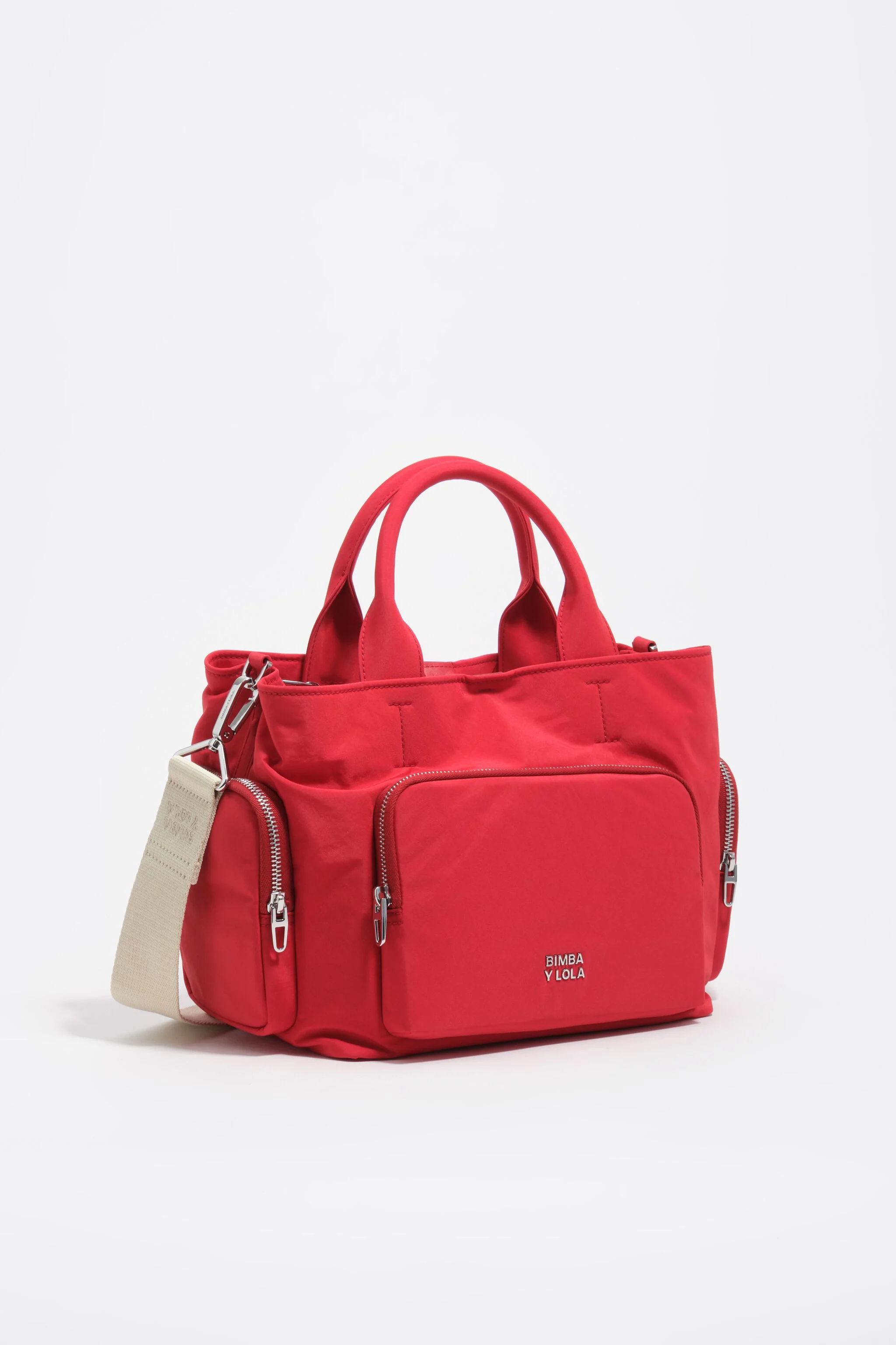 Bolsa transversal grande de nylon vermelha com bolsos.