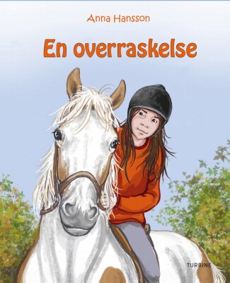 En Overraskelse - Rideskolen 6 - Anna Hansson - Bog