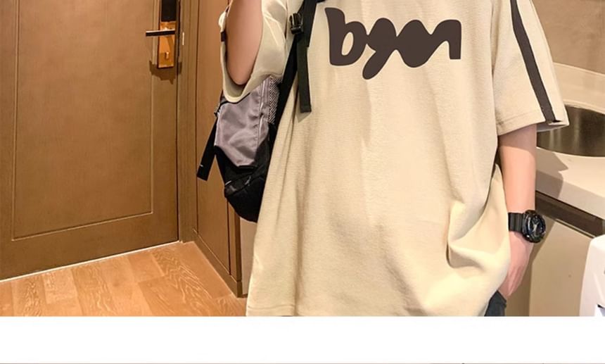 FOEV - T-shirt met ronde hals en letters, elleboogmouwen en raglanmouwen