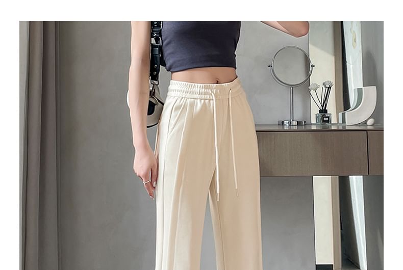 Tel tot 10 - Effen wijd uitlopende broek met trekkoord in de taille (verschillende ontwerpen)