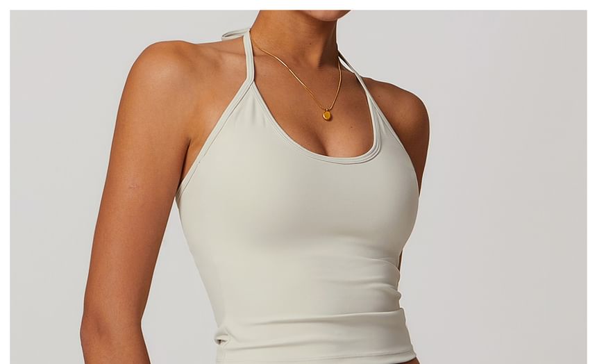 Skinniano - Haltertop met effen padding en open rug, cropped sporttop