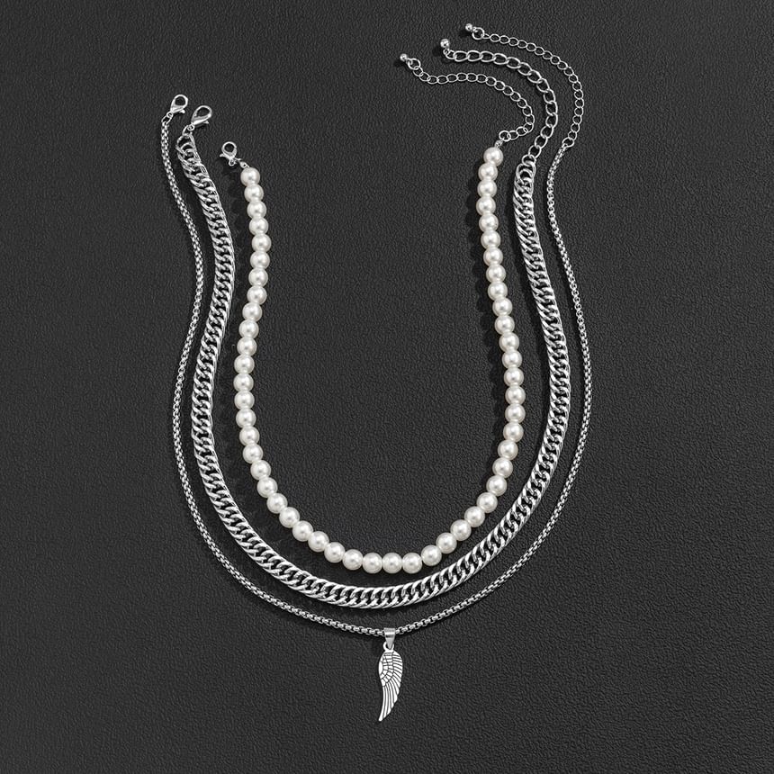 Gretlyn - Set: Kunstparelketting + Ketting + Vleugelhangerketting