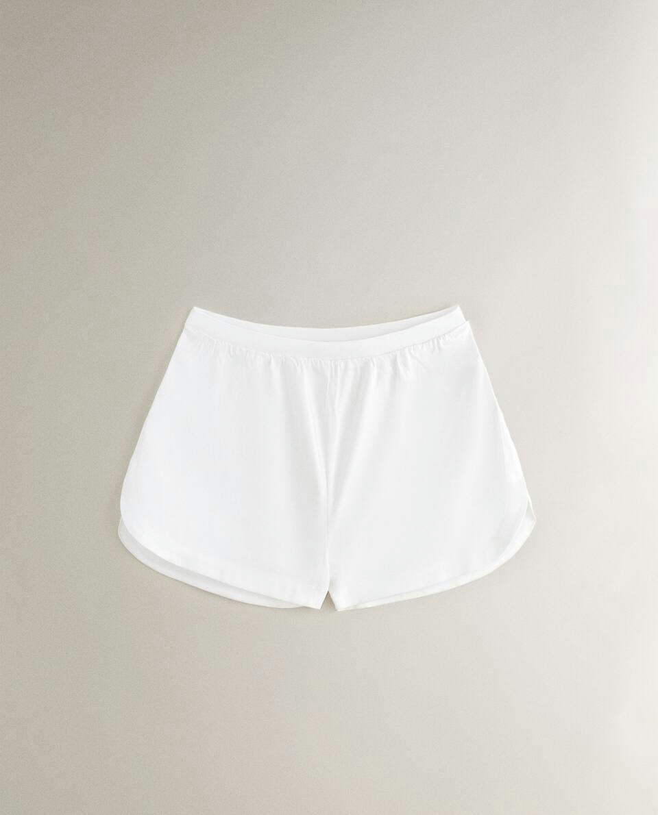 SHORTS BRANCOS DE TOQUE MACIO