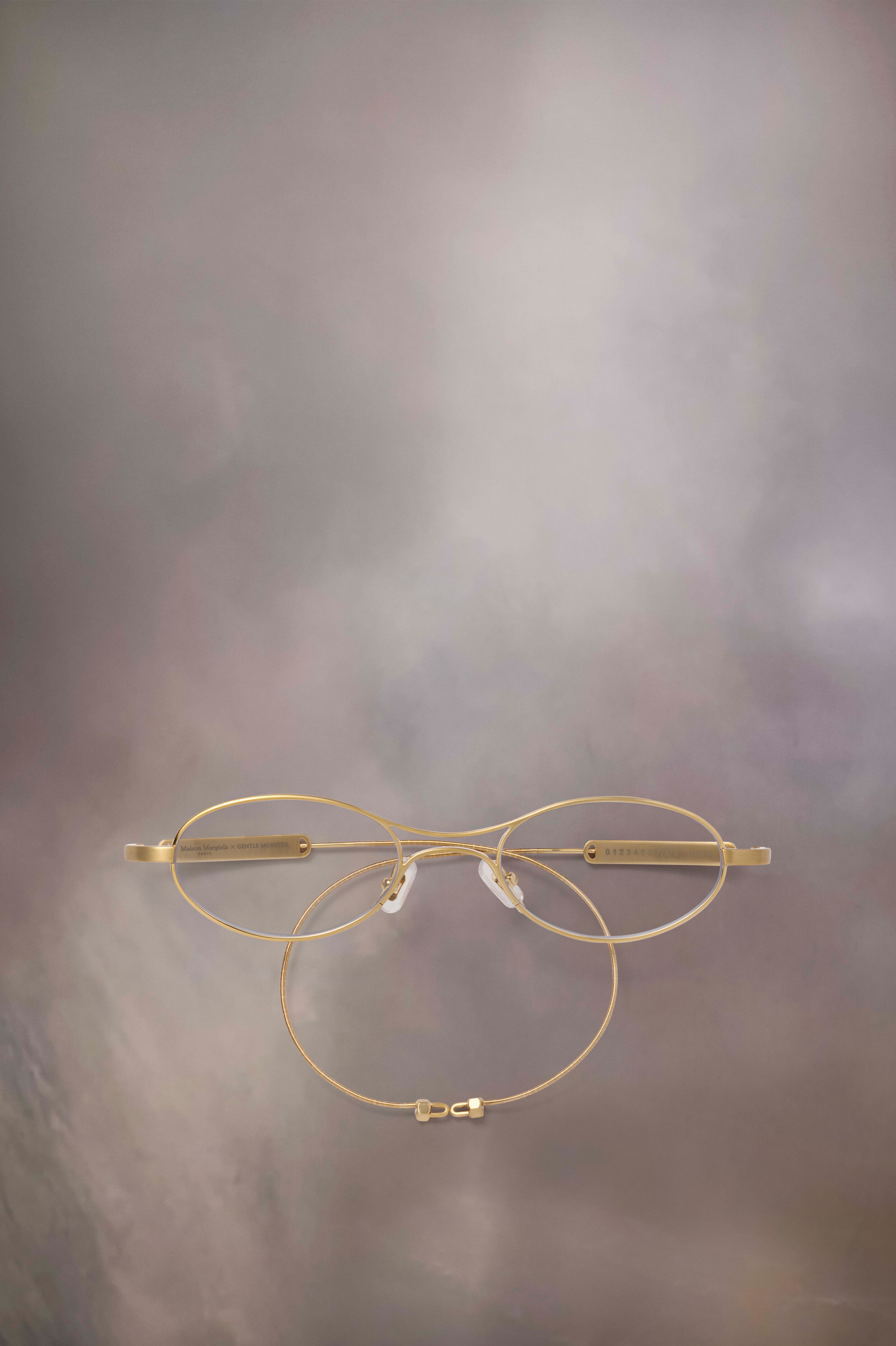 Lunettes ovales dorées x Gentle Monster​