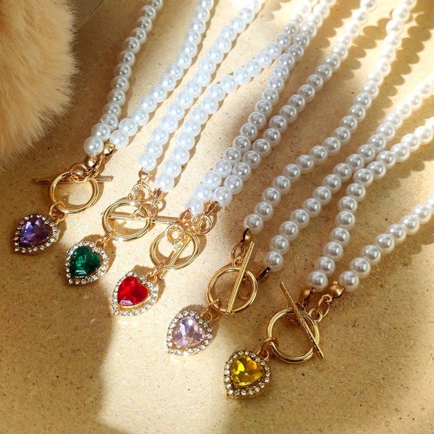 Gemsha - Kunstparelketting met strass-hartjes en hart