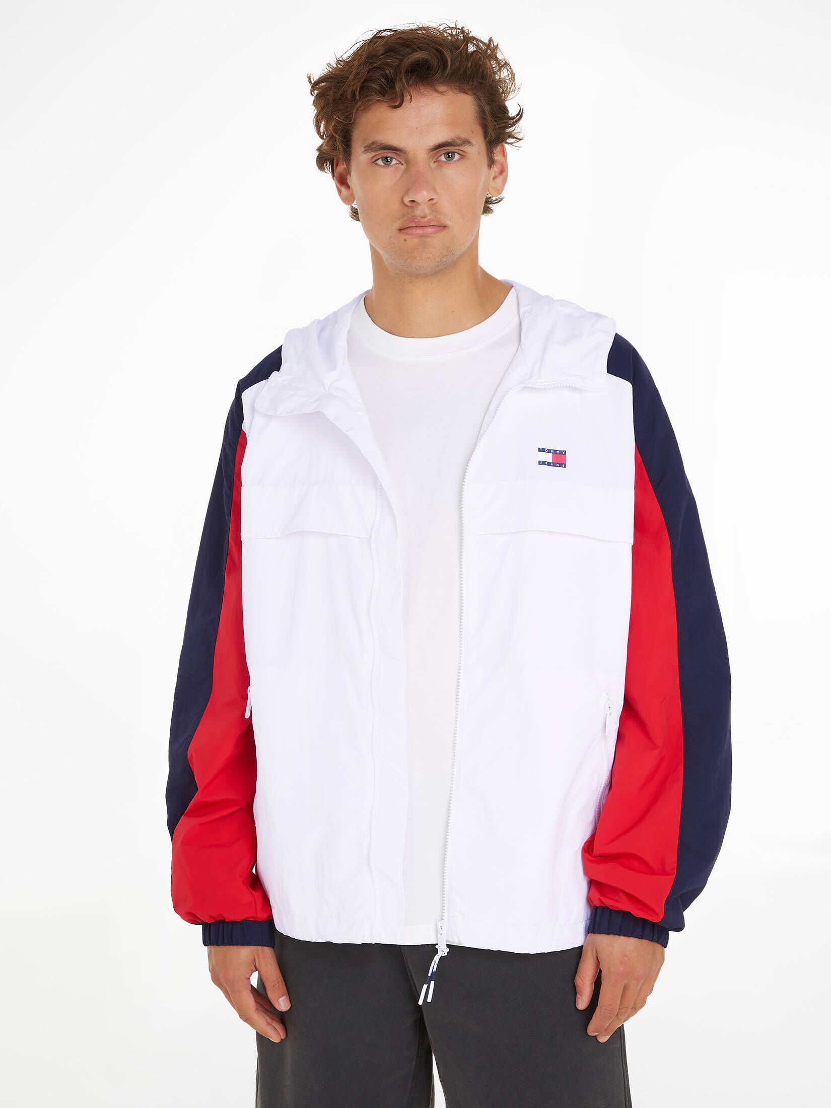Tommy Jeans| Herren Kapuzenjacke TJM CHICAGO CLBK WINDBREAKER