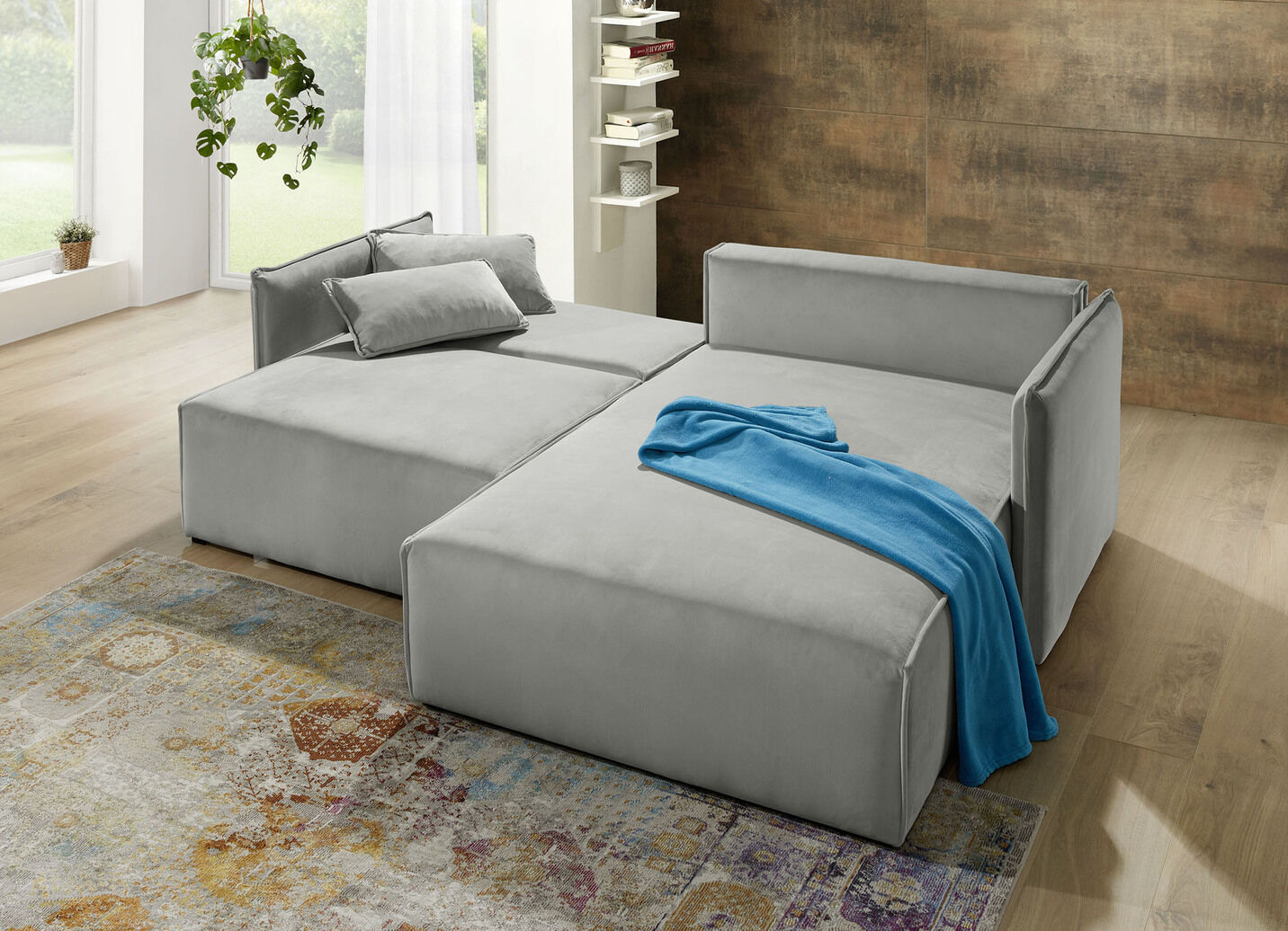 Polsterecke mit Bettfunktion und Hocker