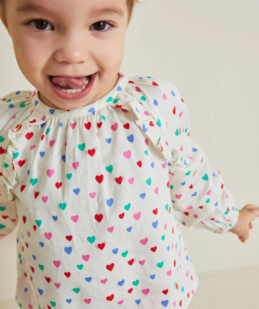 BLOUSE BÉBÉ FILLE ÉCRUE AVEC IMPRIMÉ COEURS COLORÉS