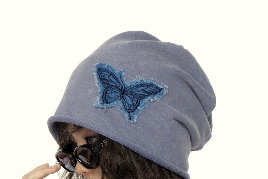 Volg mij - Slouchy muts met vlinderapplicatie