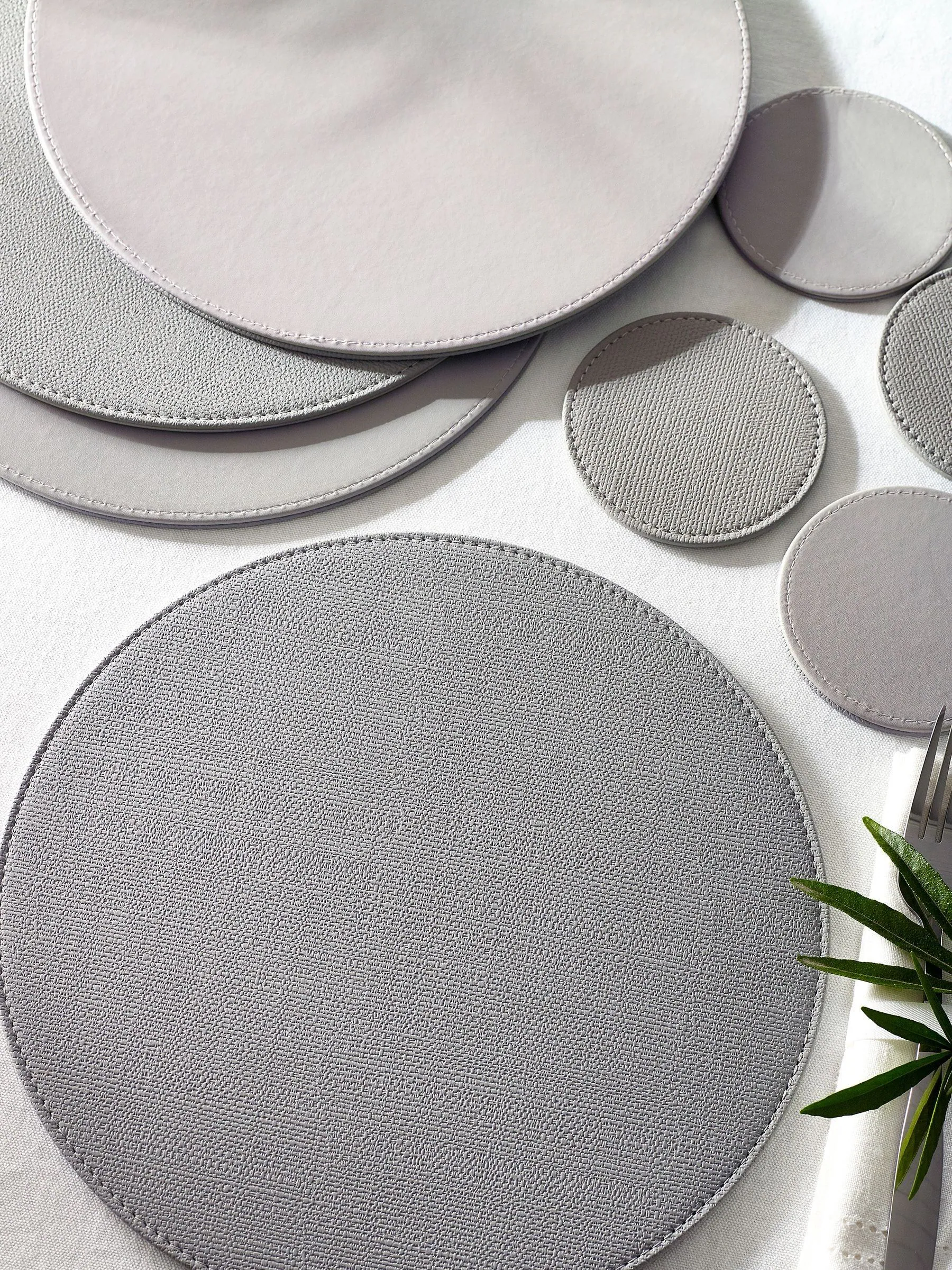 Set van 4 omkeerbare placemats en onderzetters van imitatieleer