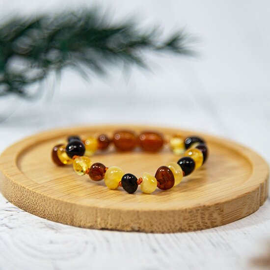 Bracelet Ambre bébé   Multi        de               Irréversible