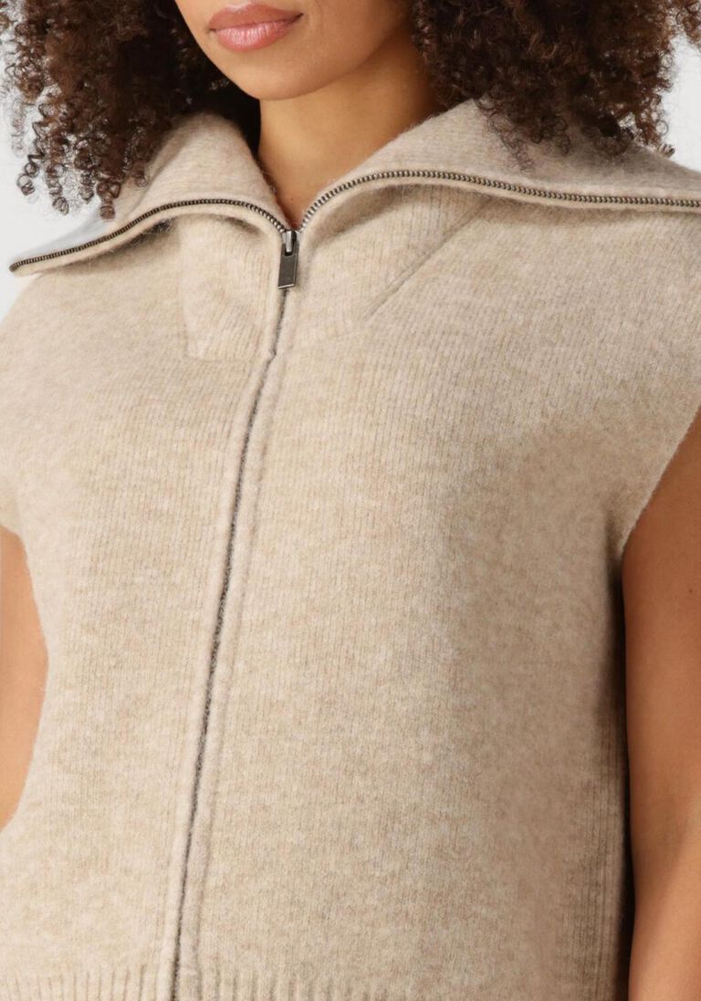 beige knit-ted vest may