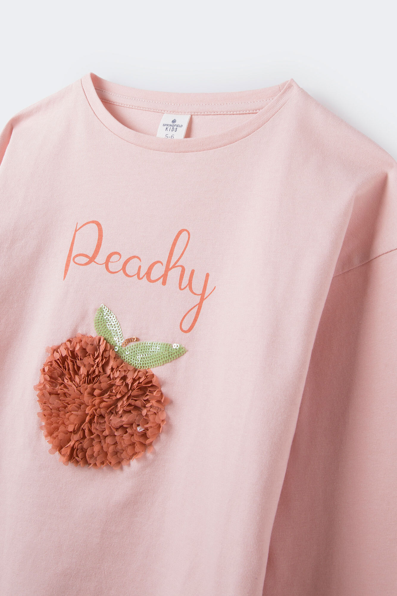 Camiseta cor de pêssego para meninas