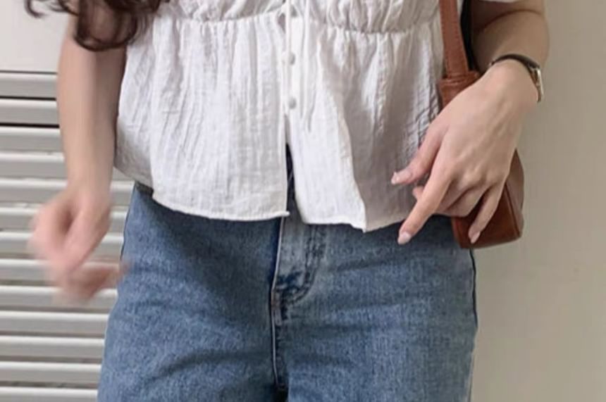 minaga - Effen blouse met kanten rand en pofmouwen