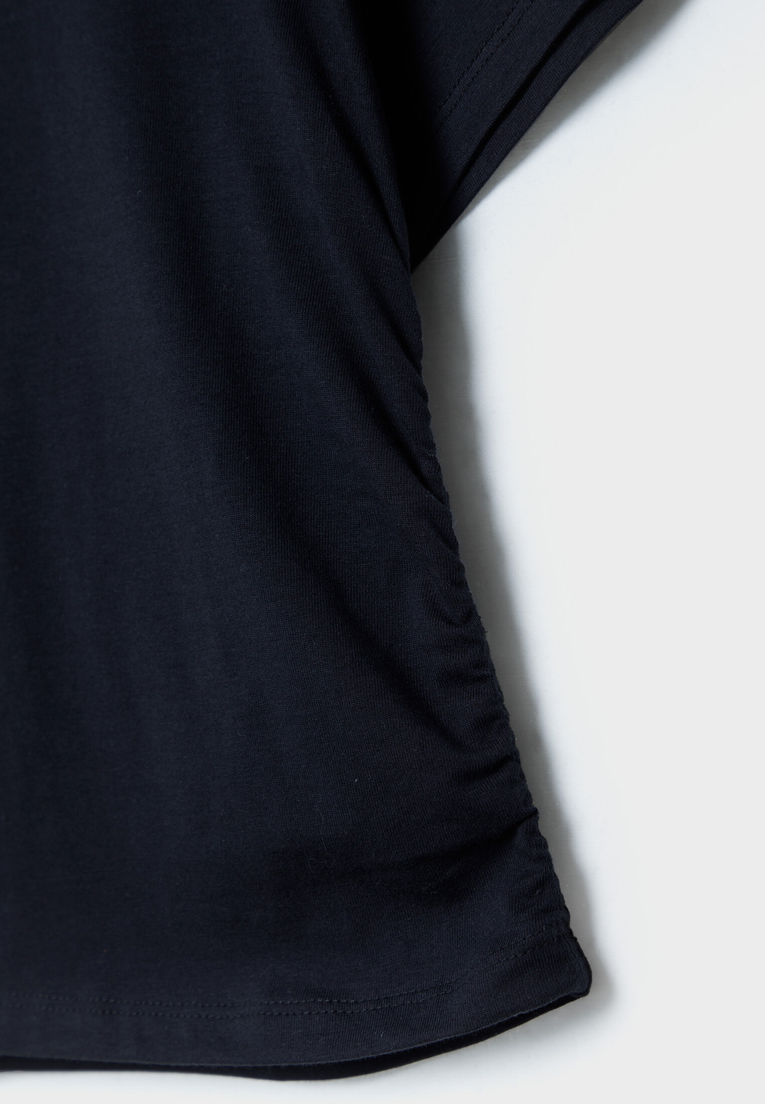 Camiseta de algodão com franzido lateral