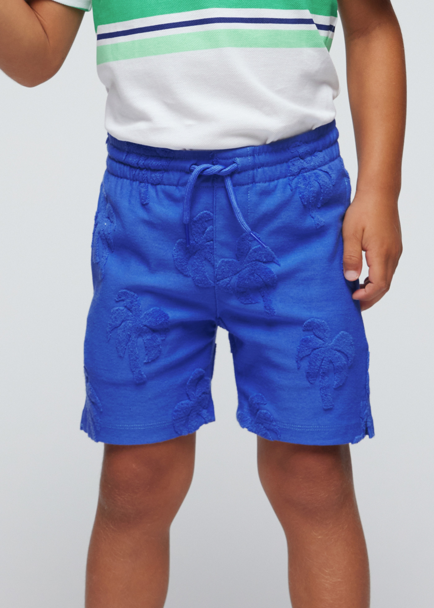 Palmeiras Bermudas menino encaracolado