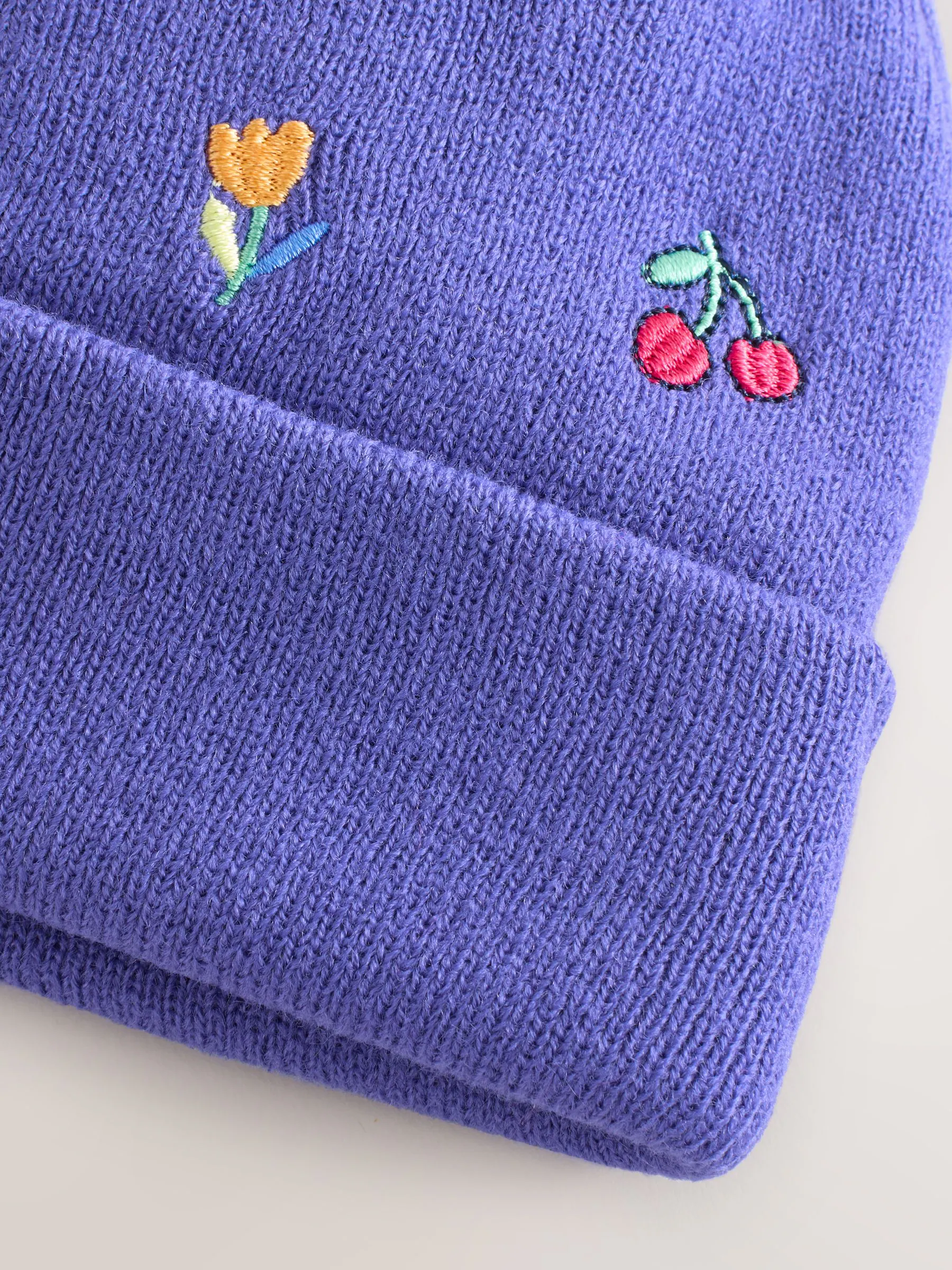 Multi - Geborduurde Beanie-muts met pompon (3mnd-10jr)