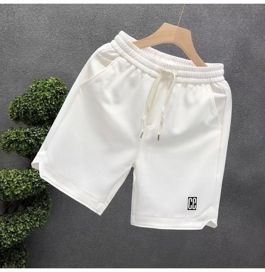 Mokoloko - Sweatshorts met trekkoord en letterprint