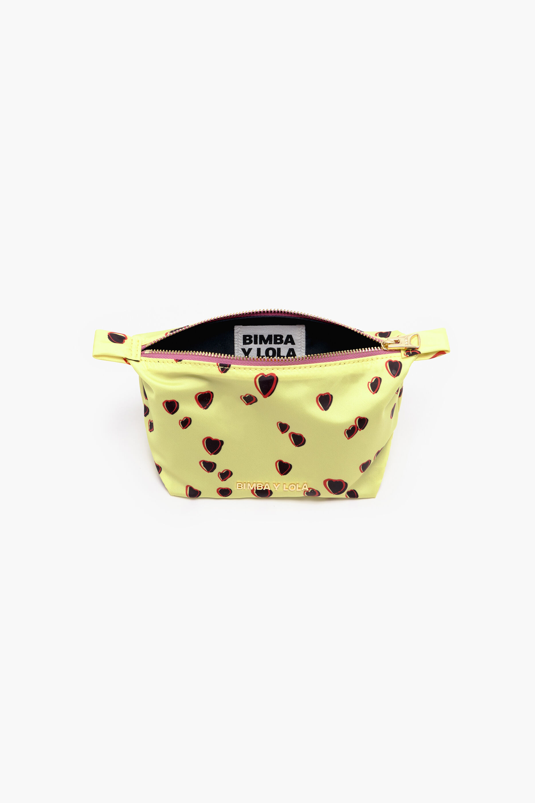 Nécessaire trapezoidal com estampa de corações pequenos em amarelo.