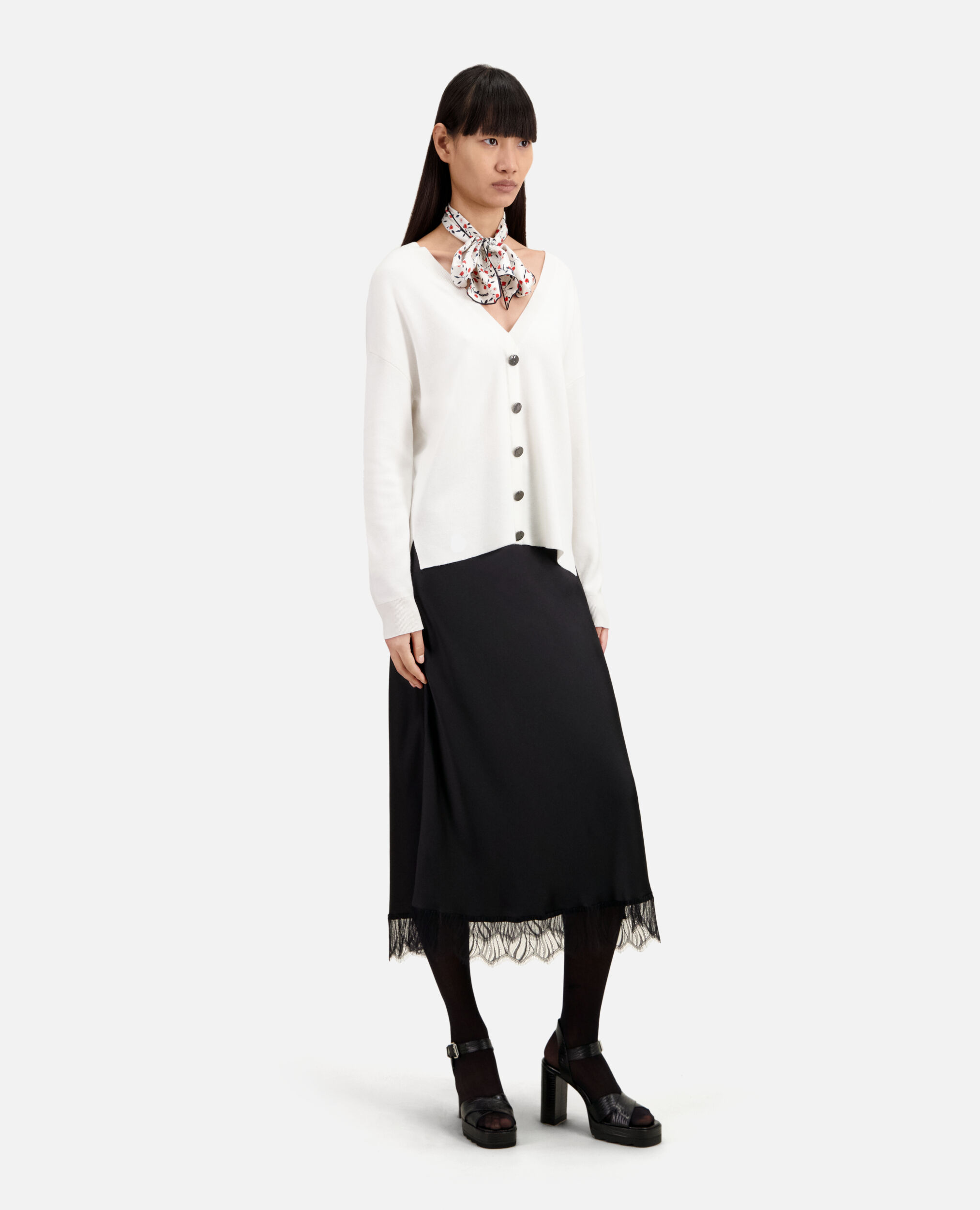 Ecru sweater with buttoning on the back