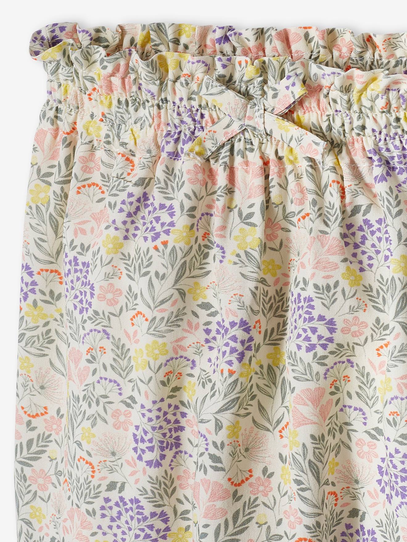 Calças fluidas estampadas para bebês na cor cru.