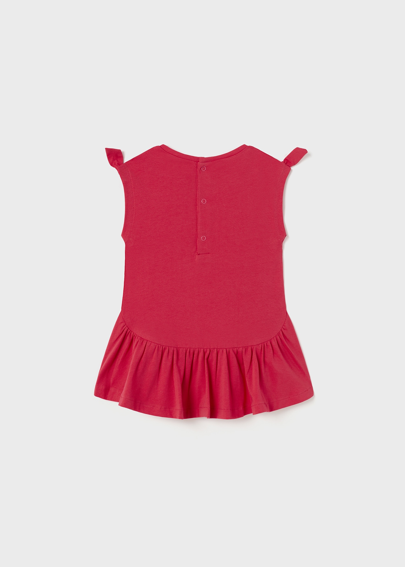 Vestido de bebê com estampa interativa feito de algodão sustentável.