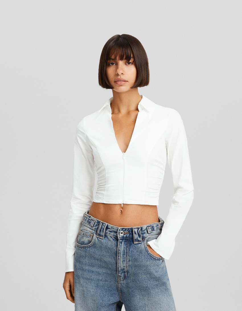 Blusa bengaline de manga comprida com zíper.