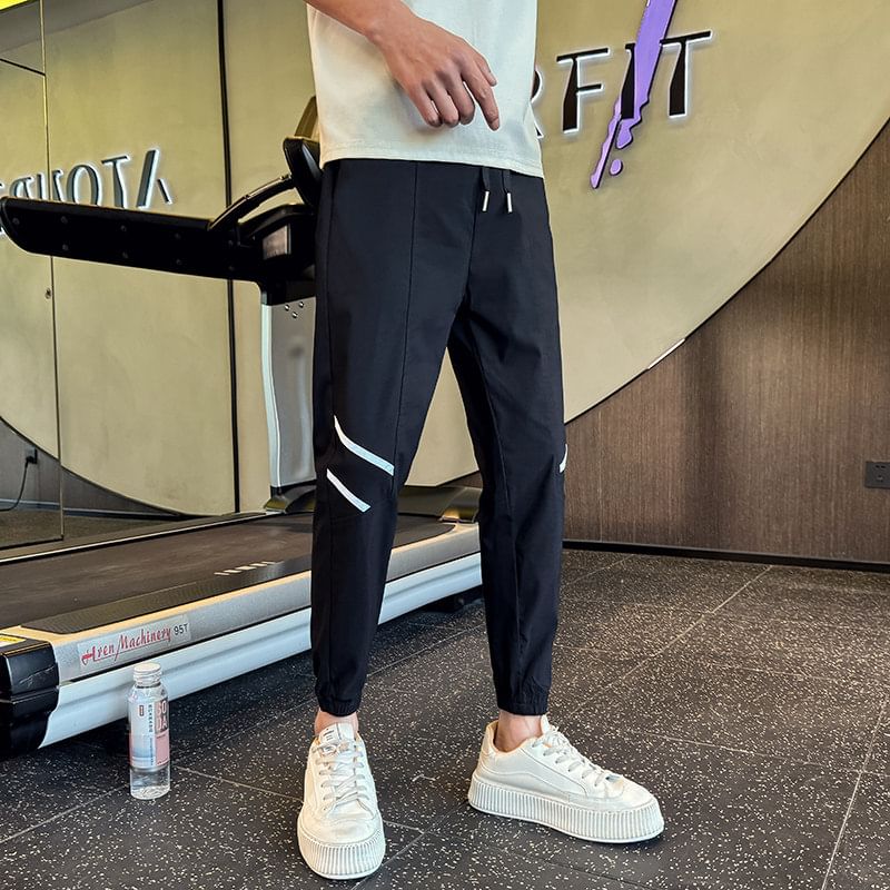 Ayuyel - Tweekleurige cropped taps toelopende broek met trekkoordtaille