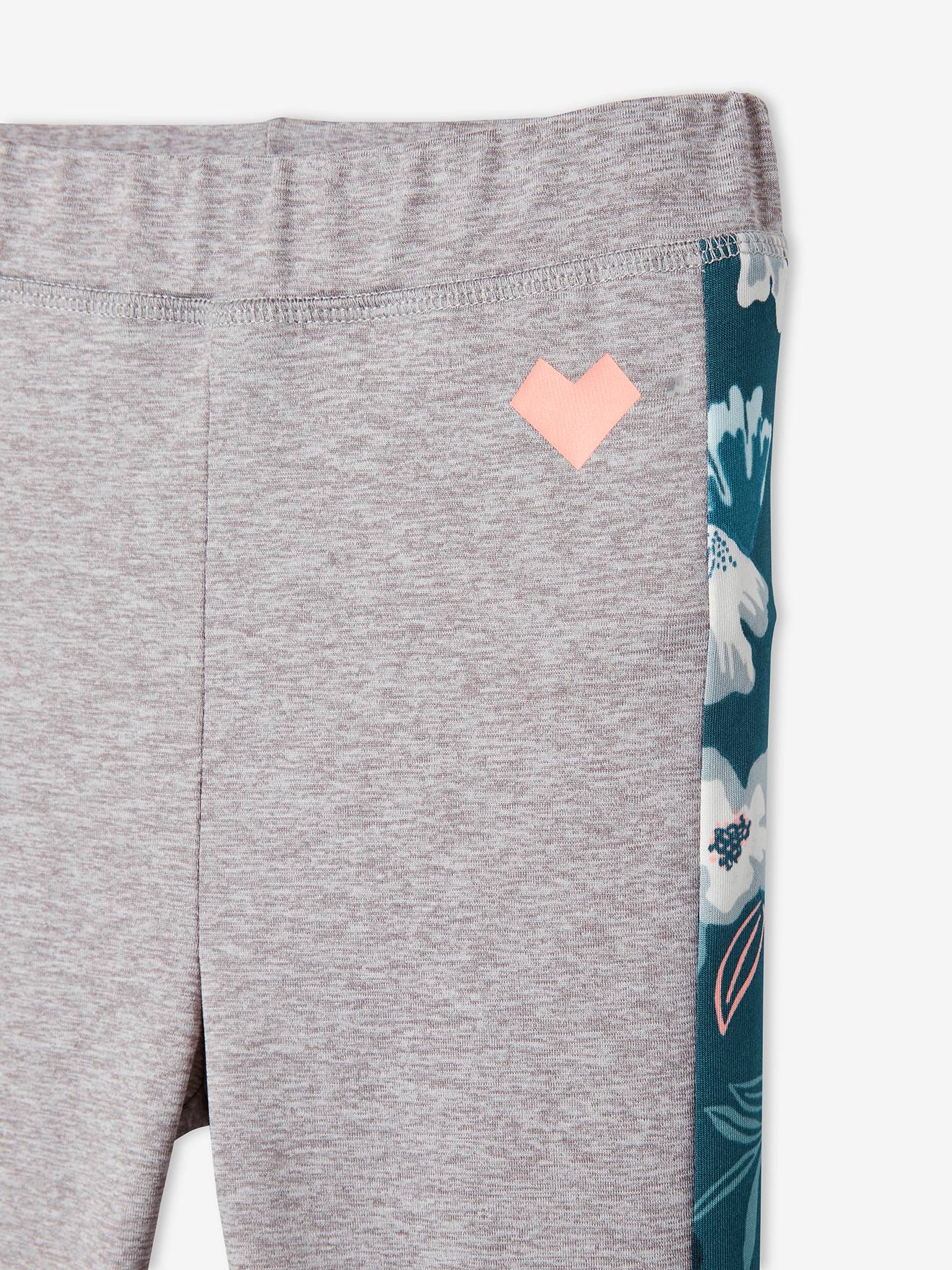 Leggings esportivas femininas em tecido técnico, cinza claro liso com estampas.