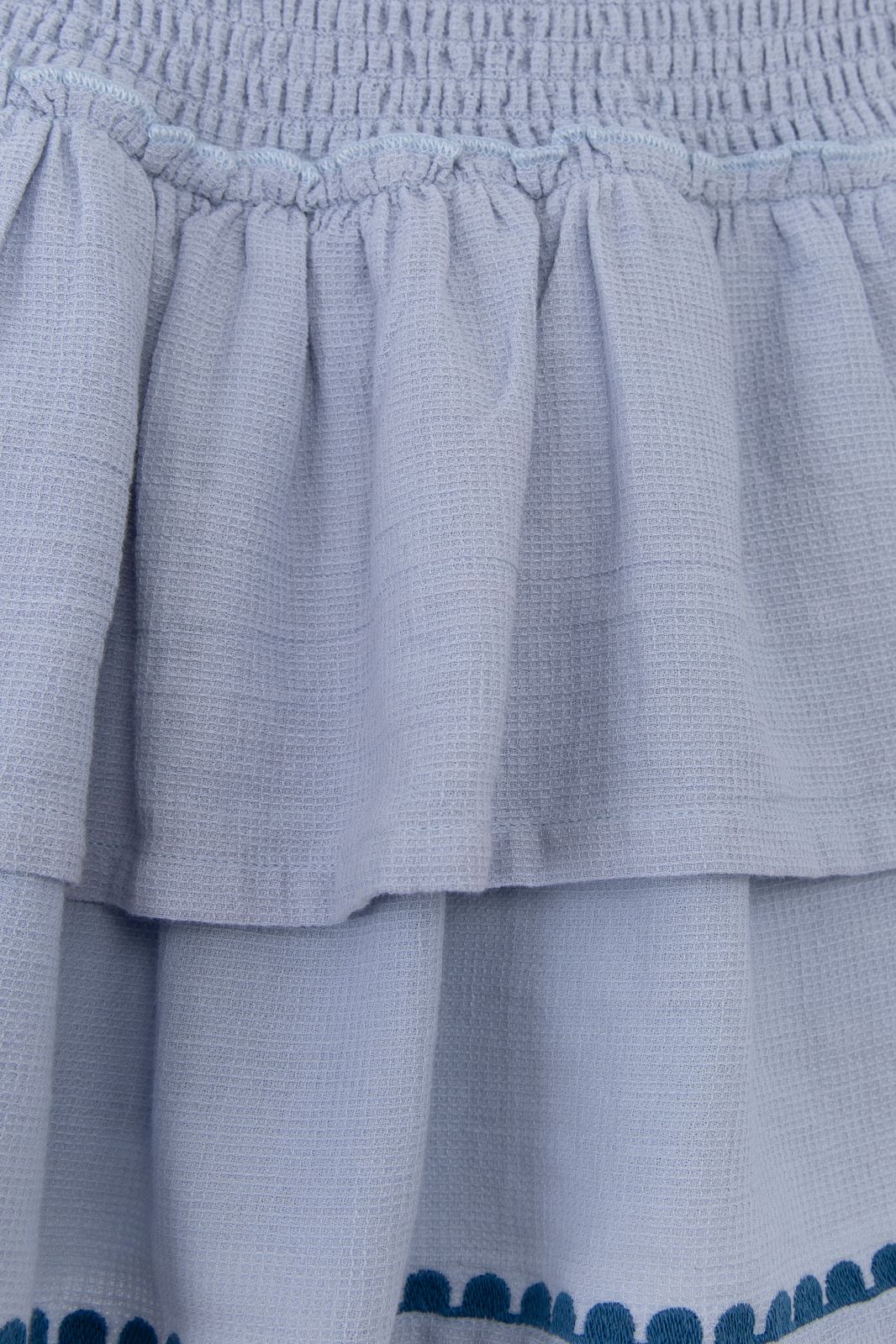 Blauw ruffle rok met geborduurde details