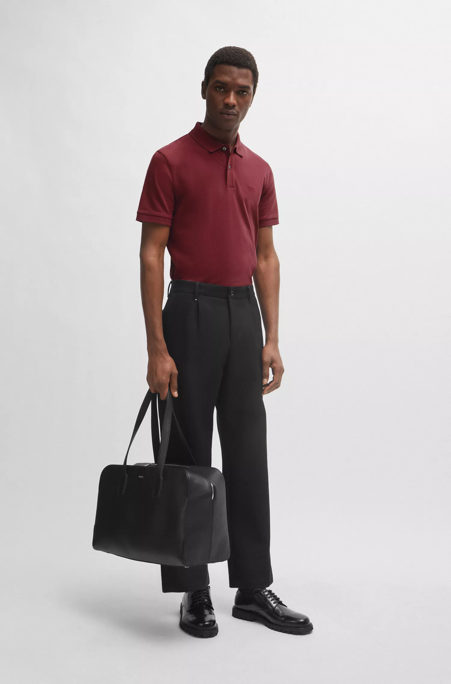 Camisa polo BOSS preta em algodão com logotipo bordado.