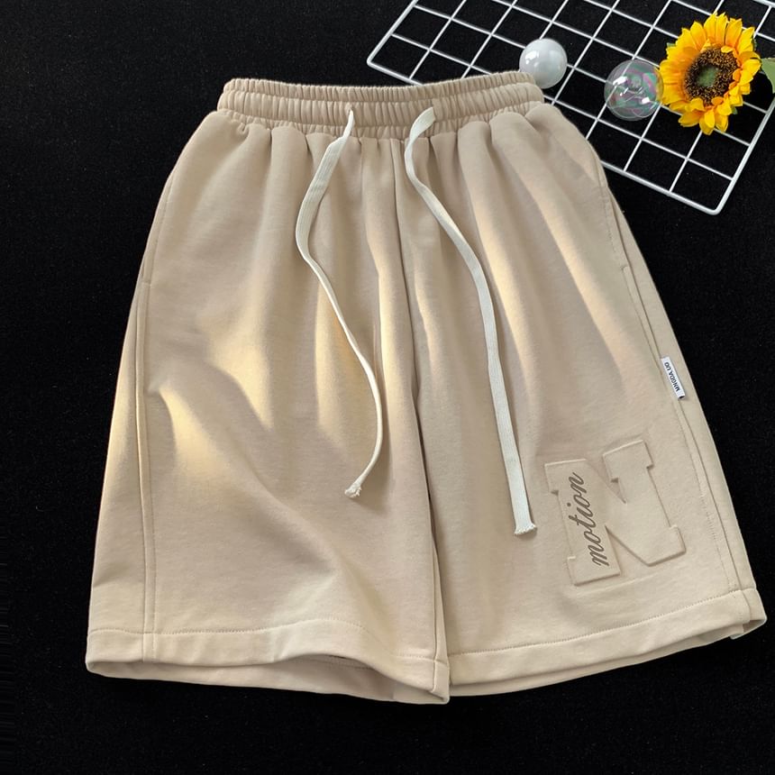 Breeson - Wijde joggingbroek met trekkoord en reliëfletters